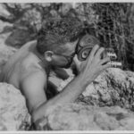 my father filming on a hike - 1956